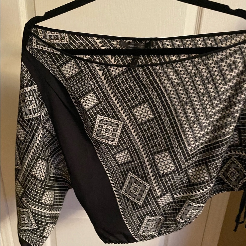 BCBG women’s off the shoulder top. Size small. Has a slit on side of sleeve.